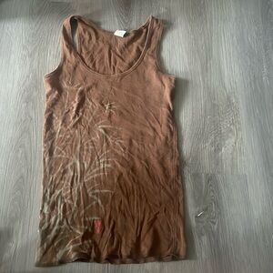 Brown tank top. Never worn. Subtle design in left side